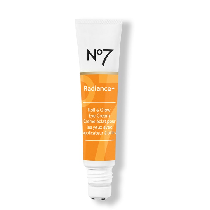No7 Radiance+ Roll & Glow Eye Cream oppfriskende øyekrem i hvit og oransje tube med tre små metallkuler.