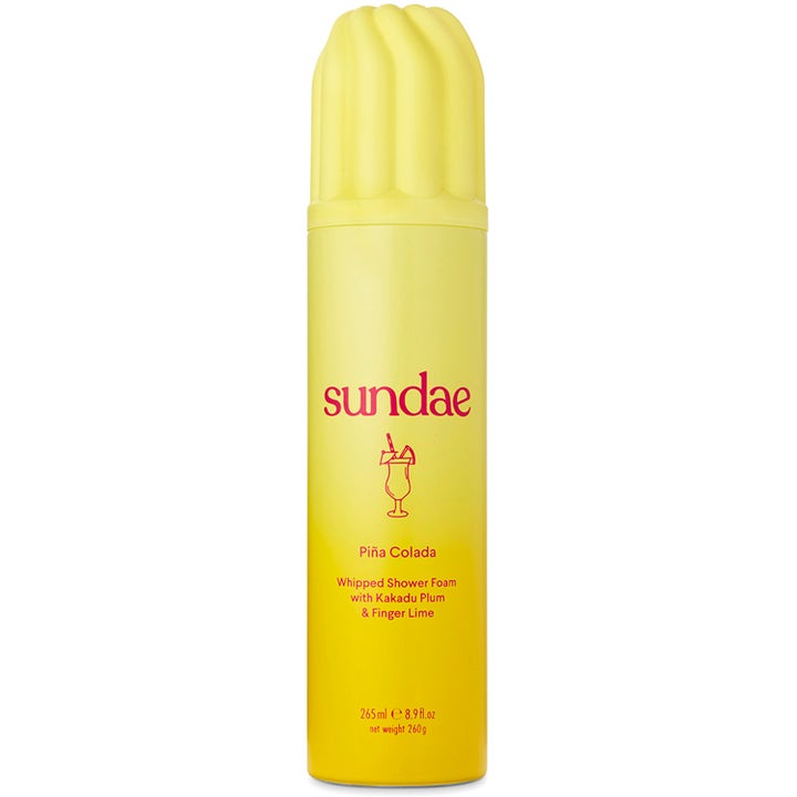 Sundae Piña Colada 265 ml fuktighetsgivende dusjskum i gul sprayflaske med bølgeformet kork