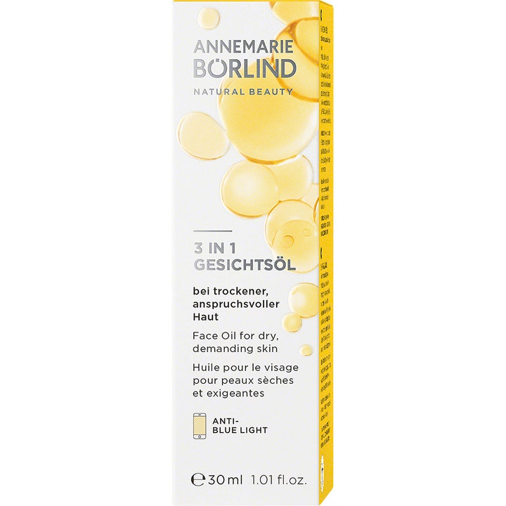 Annemarie Börlind 3-in-1 Facial Oil 30 ml ansiktsolje mot blått lys i hvit eske med gylne oljedråper.