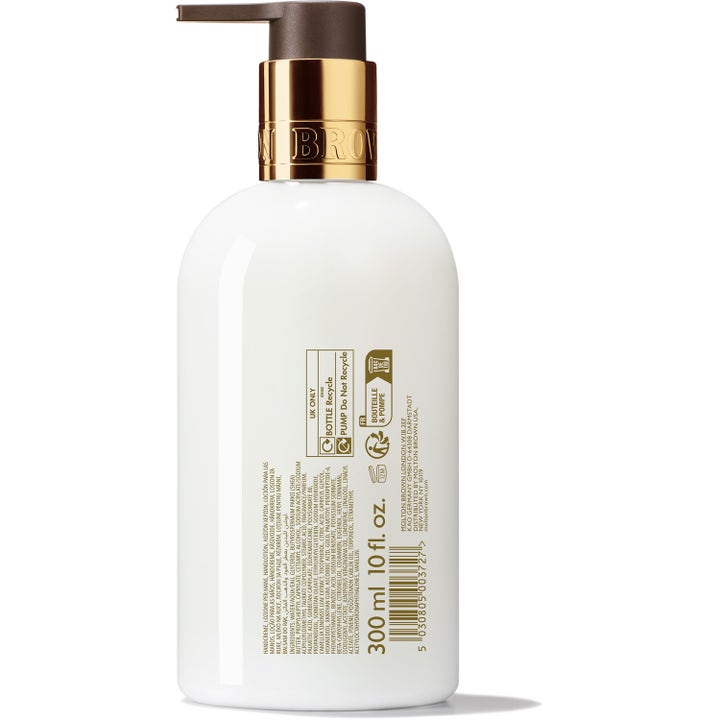 Molton Brown Mesmerising Oudh Accord & Gold Hand Lotion 300 ml fuktighetsgivende handlotion hvit flaske sett bakfra