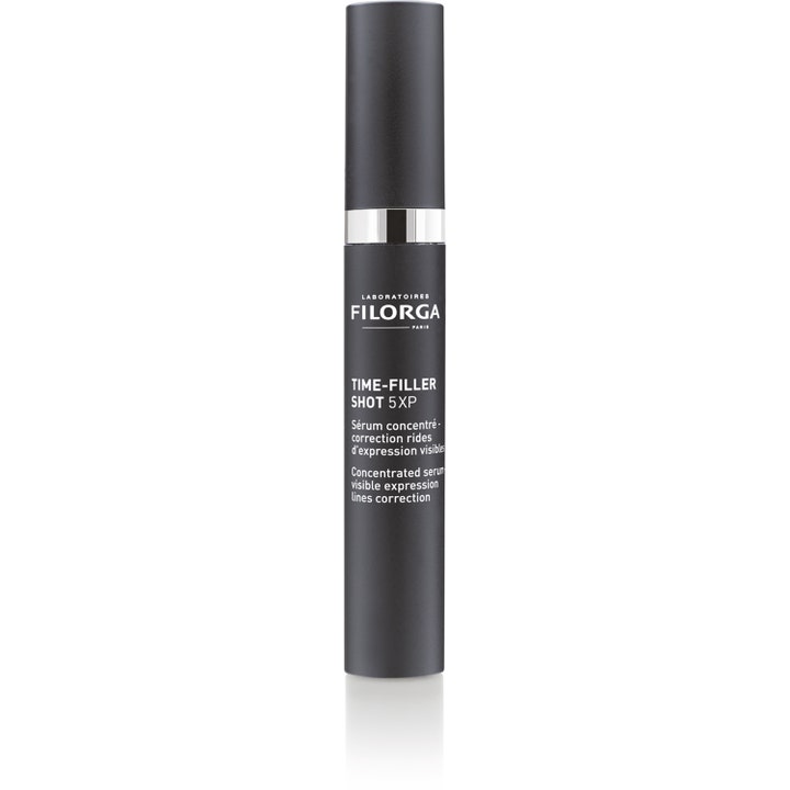 Filorga Time-Filler Shot 5XP 15 ml rynkekorrigerende serum i en stilren svart sylinderformet tube med sølvdetaljer.