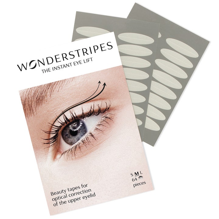 Wonderstripes Instant Eye Lift 64 stk øyeløft-tape korrigerer tunge øyelokk vist med ark med ovale, diskrete taper.