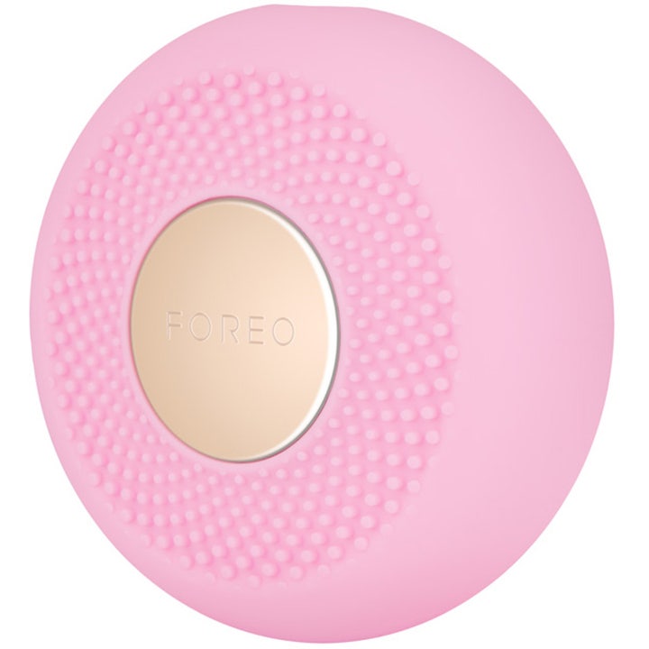 FOREO UFO mini 2 Pearl Pink ansiktsbehandling i rosa silikon som gir glød med teksturert overflate og gulldetalj.