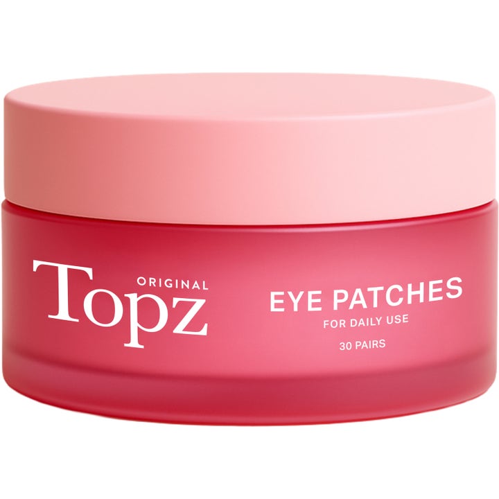 Topz Original Eye Patches 30 par øyemasker som gir fuktighet i en frostet rosa glasskrukke med lyserosa lokk.