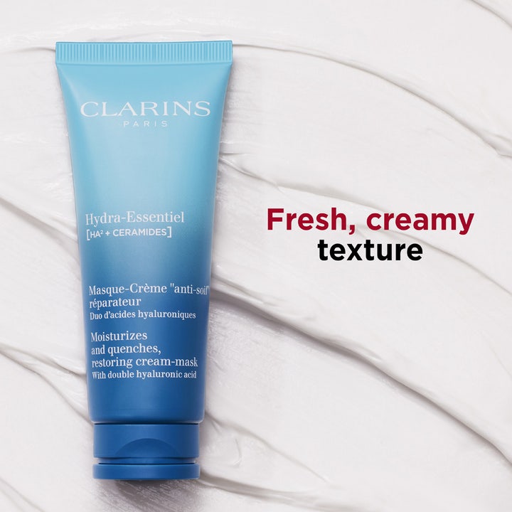 Clarins Hydra-Essentiel 75 ml fuktighetsgivende ansiktsmaske blå tube på en hvit kremet tekstur