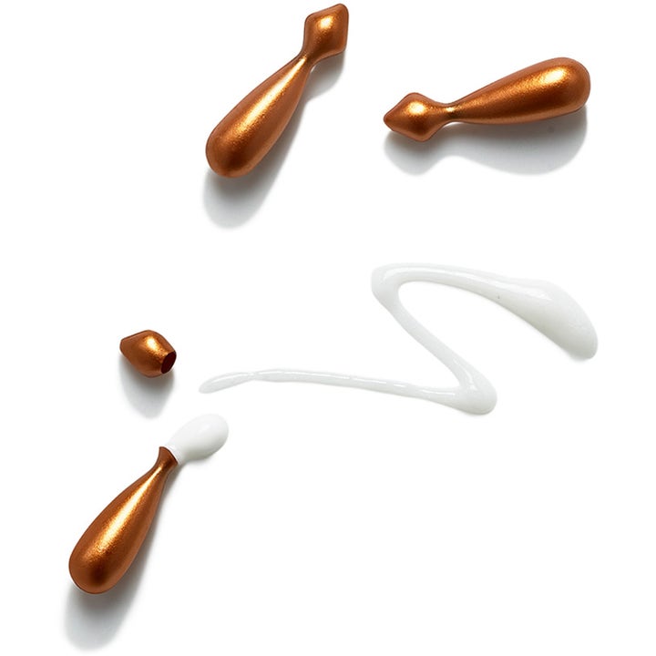 Exuviance Vitamin C Serum Capsules 60 stk glødgivende serum med bronsefargede kapsler og hvit kremet tekstur