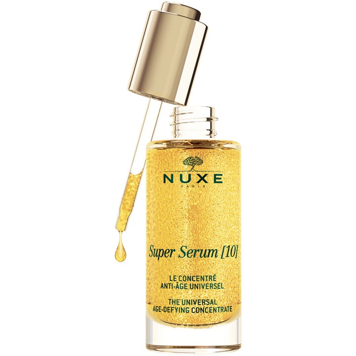 Nuxe Super Serum [10] 50 ml anti-age ansiktsserum i glassflaske med gullpipette og gylne mikrokapsler.