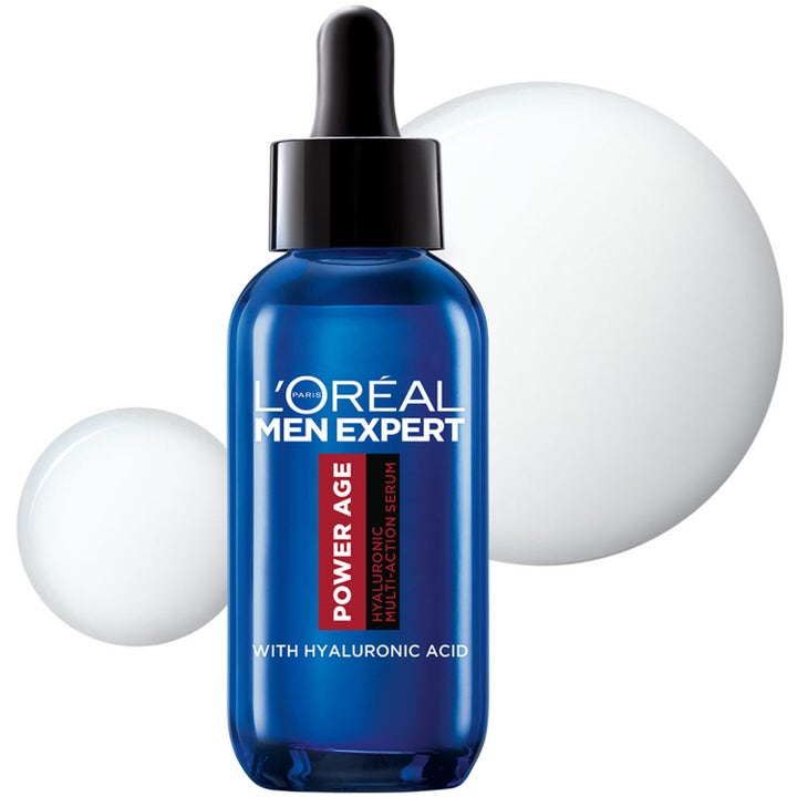 L'Oréal Paris Men Expert Power Age Serum 30 ml fuktighetsgivende serum i blå glassflaske med pipette foran hvite dråper