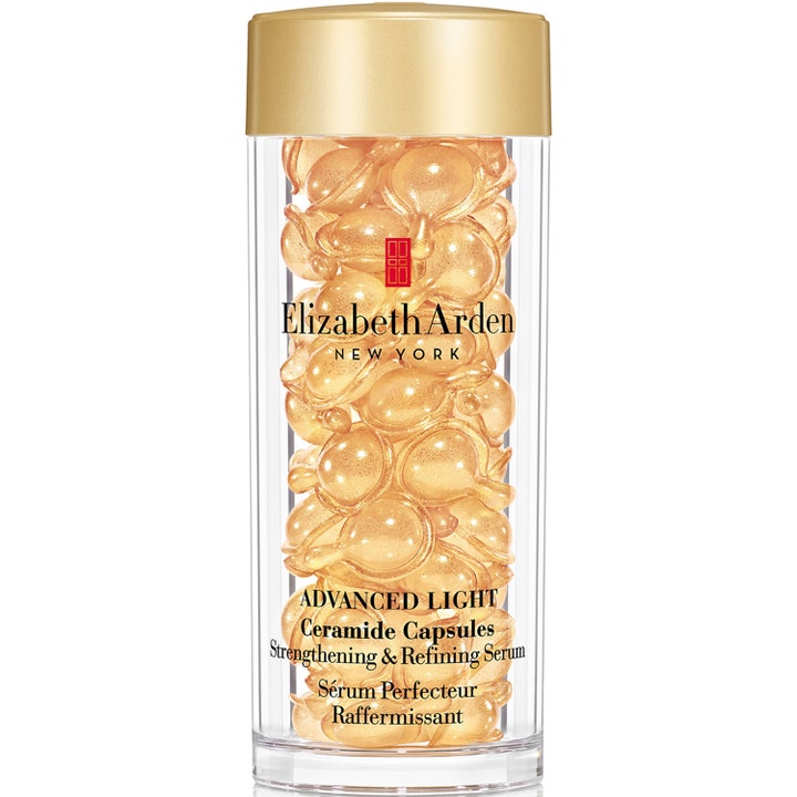 Elizabeth Arden Advanced Light Ceramide Capsules styrkende serum i klar beholder fylt med gylne kapsler og matt gullokk