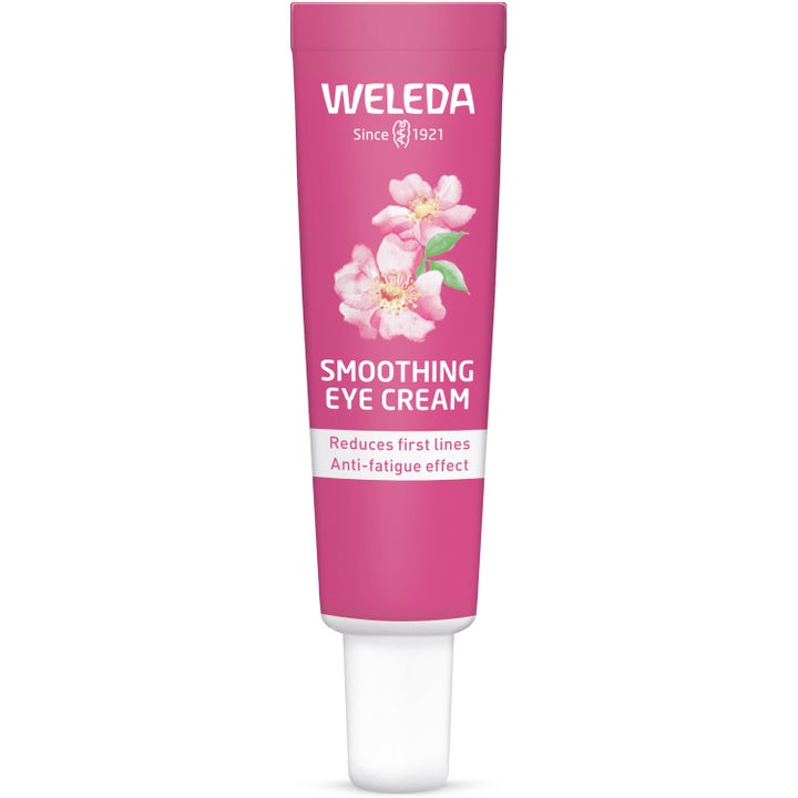 Weleda Smoothing Eye Cream 10 ml utglattende øyekrem som reduserer de første linjene i en rosa tube med blomstermotiv.
