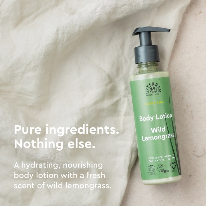 Urtekram Wild Lemongrass Body Lotion 245 ml fuktighetskrem på lyst tekstil med teksten Pure ingredients