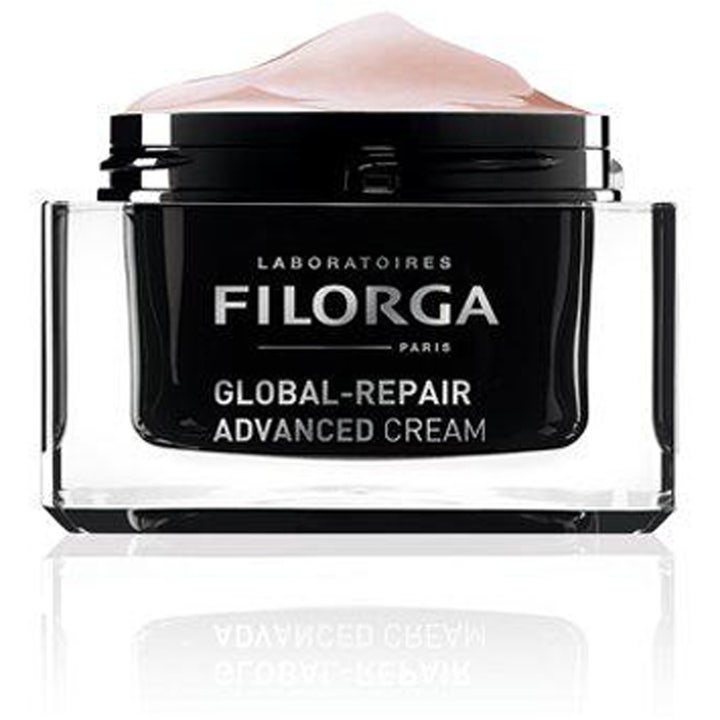 Filorga Global-Repair Advanced Cream 50 ml reparerende ansiktskrem i åpen sort krukke med lys rosa tekstur.