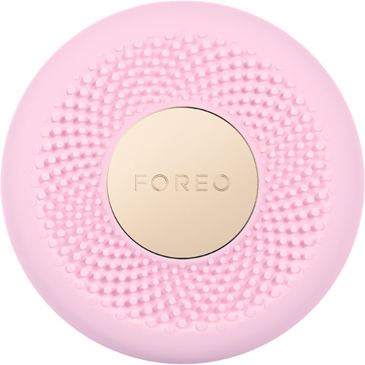 FOREO UFO 3 Pearl Pink 1 stk hudpleieenhet gir fuktighet med rosa silikontekstur og gullfarget plate.