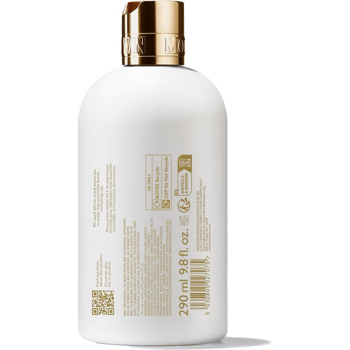 Molton Brown Milk Musk Bath & Shower Gel 300 ml dusjsåpe i hvit flaske med gullkork som viser ingredienslisten