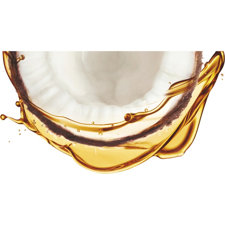 Garnier Ambre Solaire Natural Bronzer 75 ml selvbruning for ansiktet viser en delt kokosnøtt med gyllen olje