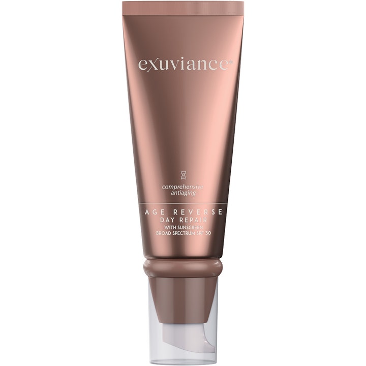 Exuviance Age Reverse Day Repair 50 g anti-aging dagkrem i bronsefarget tube med pumpe og gjennomsiktig lokk