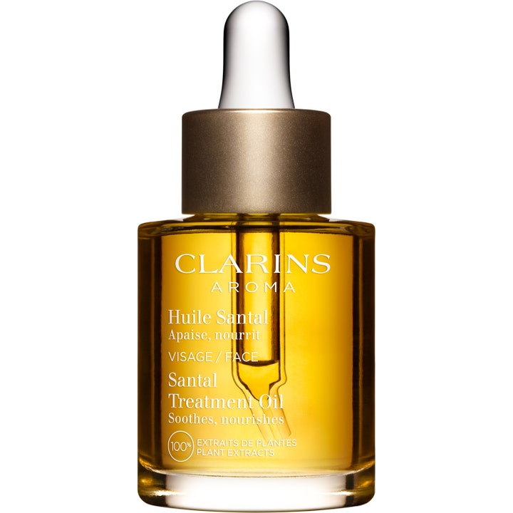 Clarins Santal Treatment Oil 30 ml beroligende ansiktsolje i glassflaske med gullkork og pipette.