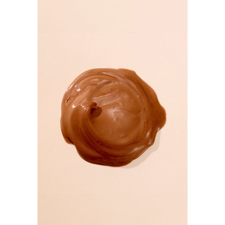 Hickap Bronze Glow Priming Moisturizer Brown 50 ml glødgivende dagkrem med en kremet bronsefarget og skimrende tekstur.