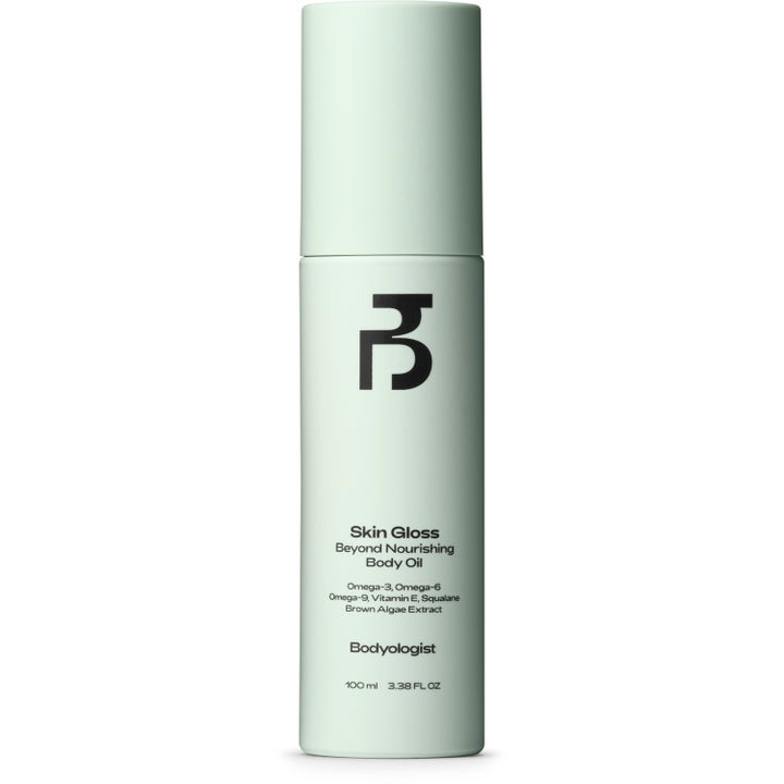 Bodyologist Skin Gloss Beyond Nourishing Body Oil 100 ml kroppsolje med squalane i en lys grønn sylindrisk flaske
